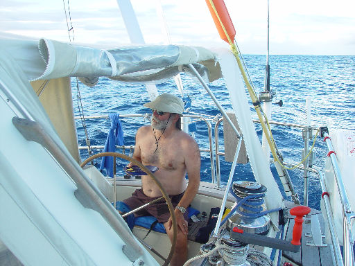 Craig at the wheel, eating dinner.