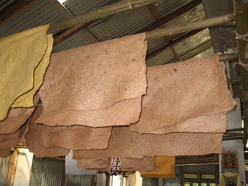 IMG_2869.JPG - Finished paper hanging from the rafters of the paper factory.