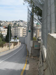 Road split in two by the Security Wall